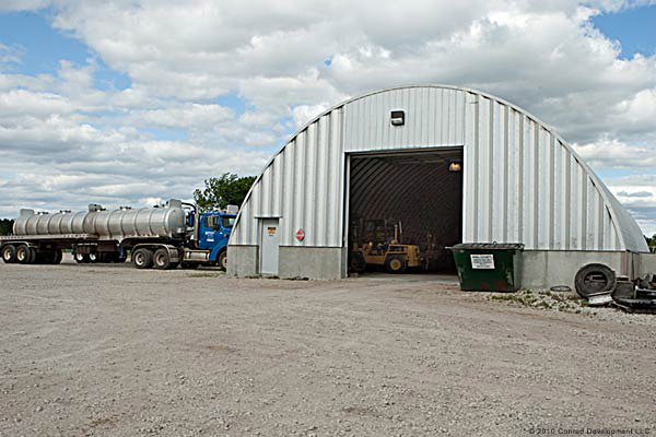 Tanker truck and q-model warehouse